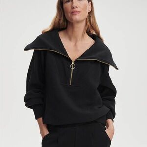 Varley half-zip, black with gold zipper. Small